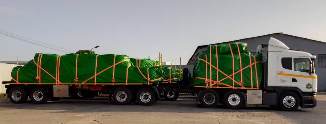TTC Scania truck with green-covered trailers